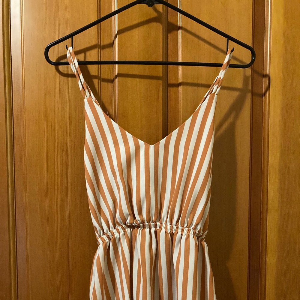 My story orange and white striped tank top with criss-cross back size small
